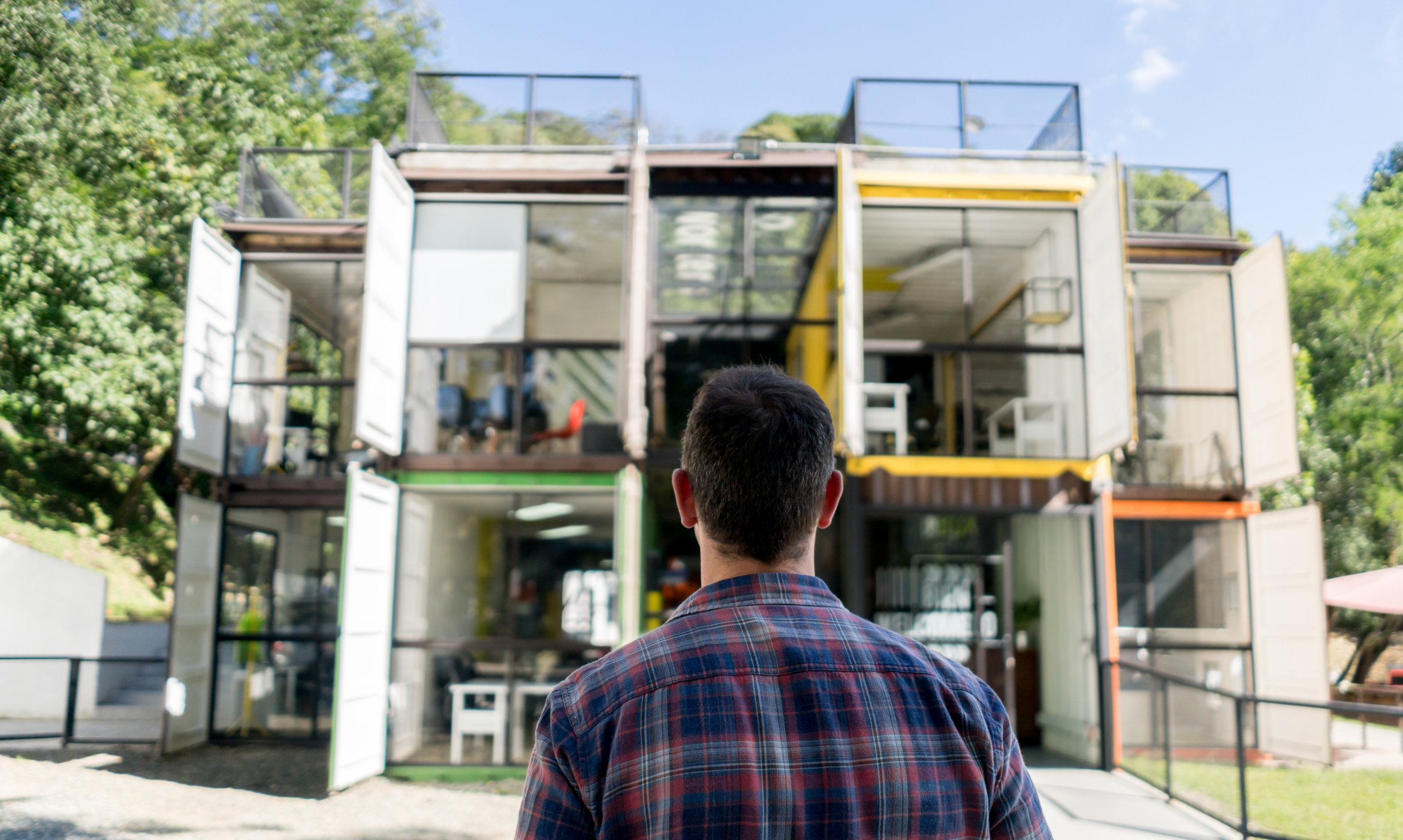 Architect looking at container office